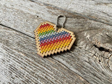 Load image into Gallery viewer, Rainbow heart DIY laser cut wood cross stitch kit by Canadian Stitchery