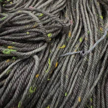 Load image into Gallery viewer, Close-up of gray yarn with specks of green and yellow.