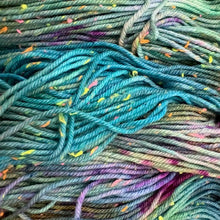 Load image into Gallery viewer, Close-up of colorful yarn with a gradient from green to purple.