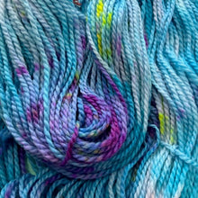Load image into Gallery viewer, Close-up of multicolored yarn with blue, purple, and pink hues.
